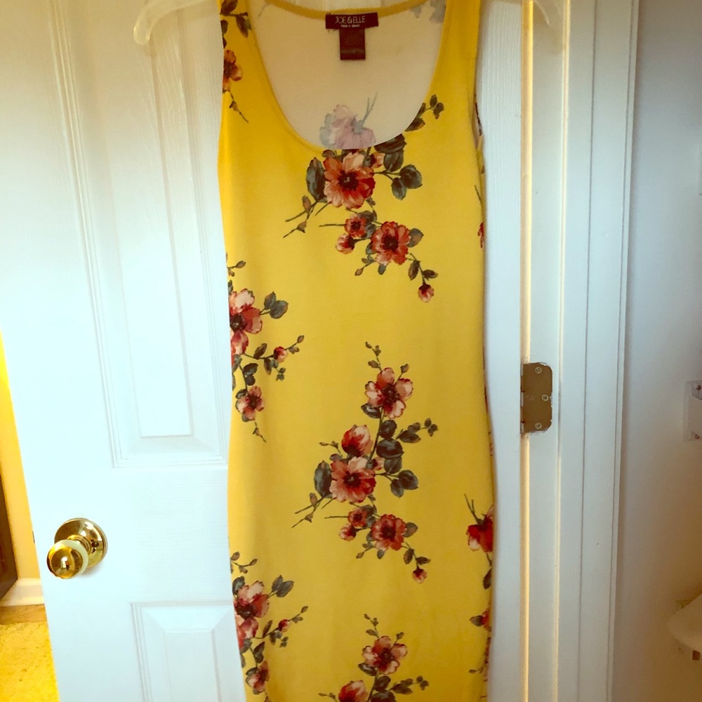yellow body hugging dress with floral pattern